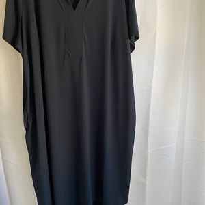 Simple black dress with pockets.